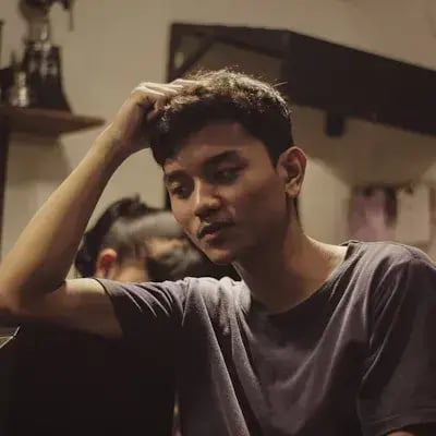 Portrait of a thoughtful man, hand in his hair